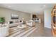 Bright living room featuring neutral furniture and decor with open floor plan at 3020 Alessa Loop, Apopka, FL 32703