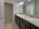 Bathroom with granite counters, dual sinks, and tile floors at 3020 Alessa Loop, Apopka, FL 32703