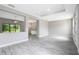 Spacious living room featuring hard surface floors, tray ceiling, and neutral paint at 30340 W Bluebell Ave, Eustis, FL 32736