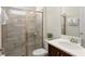 Tiled bathroom featuring glass-door shower and modern sink at 320 Auburn Ave, Kissimmee, FL 34747