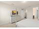 Bright bedroom featuring a four-poster bed and dresser with TV at 320 Auburn Ave, Kissimmee, FL 34747