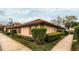 Charming corner-unit home featuring lush landscaping and well-maintained exterior at 358 Douglas Way # 78, Winter Garden, FL 34787