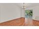 Dining room with wood floors and sliding glass doors leading to the patio at 381 Corbett Dr, The Villages, FL 32162
