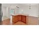 Open-concept kitchen featuring a center island and an open view to the living room at 381 Corbett Dr, The Villages, FL 32162