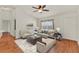 Bright living room featuring a comfortable sofa, chairs, and natural light at 381 Corbett Dr, The Villages, FL 32162