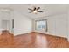 Spacious living room with luxury vinyl plank flooring, ceiling fan, and natural light at 381 Corbett Dr, The Villages, FL 32162