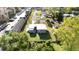 An aerial perspective of the property, highlighting the layout of the house, yard, and surrounding neighborhood at 3905 Cherry Way, Lakeland, FL 33805