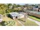 Aerial view of the home showcasing the roof, yard, landscaping, and neighborhood surroundings at 3905 Cherry Way, Lakeland, FL 33805