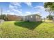 Fenced backyard with lush lawn, offering space and privacy at 3905 Cherry Way, Lakeland, FL 33805