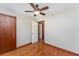 Bedroom view of door to another room, ceiling fan, and hardwood flooring at 3905 Cherry Way, Lakeland, FL 33805