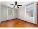 Bedroom featuring a ceiling fan, and two windows for natural light at 3905 Cherry Way, Lakeland, FL 33805