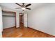 Bedroom view of a closet, hardwood flooring, and door that opens to another room at 3905 Cherry Way, Lakeland, FL 33805