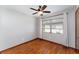 Bedroom featuring a window, ceiling fan and hardwood flooring at 3905 Cherry Way, Lakeland, FL 33805