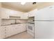 Clean kitchen with white appliances, ample cabinet space, and a modern backsplash at 3905 Cherry Way, Lakeland, FL 33805