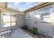 A quaint back patio area with sliding glass doors leading into the home at 3905 Cherry Way, Lakeland, FL 33805