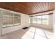 Sun room featuring multiple windows and wood plank ceiling at 3905 Cherry Way, Lakeland, FL 33805