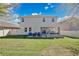 Expansive backyard with a lush lawn and covered patio, perfect for outdoor activities at 4107 Briar Gate Ln, Winter Garden, FL 34787
