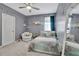 Cozy bedroom featuring a comfortable bed, soft carpet, and stylish decor at 4107 Briar Gate Ln, Winter Garden, FL 34787