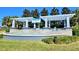 Picturesque Orchard Hills community entrance featuring a decorative pergola and fountain at 4107 Briar Gate Ln, Winter Garden, FL 34787