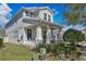 Charming home exterior featuring a welcoming porch and well-maintained landscaping at 4107 Briar Gate Ln, Winter Garden, FL 34787