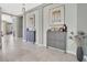 Inviting hallway with decorative furniture pieces, tiled floor, and neutral colors, creating a warm entryway at 4107 Briar Gate Ln, Winter Garden, FL 34787