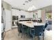 Modern kitchen featuring a large center island with seating and stainless steel appliances at 4107 Briar Gate Ln, Winter Garden, FL 34787