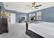 Serene primary bedroom with carpeting, a fan, and a view of the backyard at 4107 Briar Gate Ln, Winter Garden, FL 34787