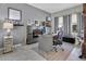 Stylish office with a modern desk, sleek fireplace, and ample natural light, perfect for productivity and comfort at 4107 Briar Gate Ln, Winter Garden, FL 34787