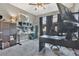 Office with a modern desk, large monitor, and custom shelving for organization and productivity in neutral colors at 4107 Briar Gate Ln, Winter Garden, FL 34787
