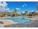 Spacious community pool with lounge chairs and tables under a sunny blue sky at 4107 Briar Gate Ln, Winter Garden, FL 34787