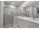Bright bathroom with double sinks, walk-in shower, and chrome fixtures at 4198 Sw 128Th Pl, Ocala, FL 34473