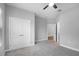 Cozy bedroom with plush gray carpet, a ceiling fan, and a closet at 4198 Sw 128Th Pl, Ocala, FL 34473