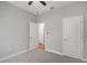 Carpeted bedroom featuring a closet and neutral paint scheme at 4198 Sw 128Th Pl, Ocala, FL 34473