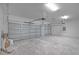 Spacious garage with concrete flooring and gray doors at 4198 Sw 128Th Pl, Ocala, FL 34473