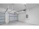 Spacious garage with concrete flooring and gray doors at 4198 Sw 128Th Pl, Ocala, FL 34473