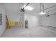 Garage with painted floor, hot water heater and garage door openers at 4198 Sw 128Th Pl, Ocala, FL 34473