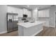 Modern kitchen with stainless steel appliances and large island at 4198 Sw 128Th Pl, Ocala, FL 34473
