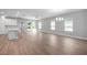 Open living space with wood floors, lots of natural light, ceiling fan, and chandelier at 4198 Sw 128Th Pl, Ocala, FL 34473