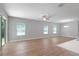Bright living room with wood-look floors, fan, recessed lights, and lots of natural light at 4198 Sw 128Th Pl, Ocala, FL 34473