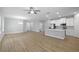 Open-plan living space combining kitchen and living room with modern finishes at 4198 Sw 128Th Pl, Ocala, FL 34473