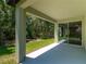 Covered patio looking out onto a lush, green yard at 4198 Sw 128Th Pl, Ocala, FL 34473