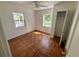 Cozy bedroom with hardwood floors, a ceiling fan, natural light, and a closet at 472 Rosalia Dr, Sanford, FL 32771