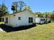 Exterior shot showing the side and back of the house in the yard at 472 Rosalia Dr, Sanford, FL 32771