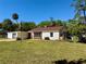 A single story home with an attached carport and a well-manicured lawn at 472 Rosalia Dr, Sanford, FL 32771