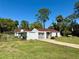A single story home with an attached carport and a well-manicured lawn at 472 Rosalia Dr, Sanford, FL 32771
