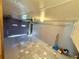 Tiled garage with an automatic door opener and interior access door at 472 Rosalia Dr, Sanford, FL 32771