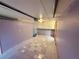 Spacious tiled garage with built in shelves and automatic door opener at 472 Rosalia Dr, Sanford, FL 32771