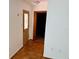 Hallway featuring hardwood floors and a stained glass decorated front door at 472 Rosalia Dr, Sanford, FL 32771