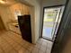 Functional kitchen offering access to sunroom, combining indoor amenities with outdoor views at 472 Rosalia Dr, Sanford, FL 32771