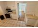 Classic kitchen leading to bright living area, blending functionality with an open concept design at 472 Rosalia Dr, Sanford, FL 32771
